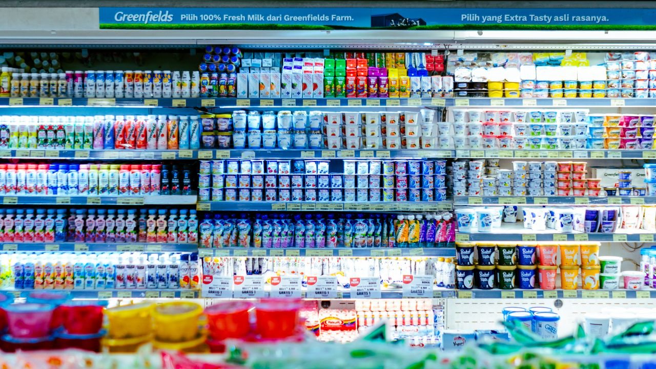 Free Vibrant shelves of diverse dairy products in a West Java supermarket. Stock Photo